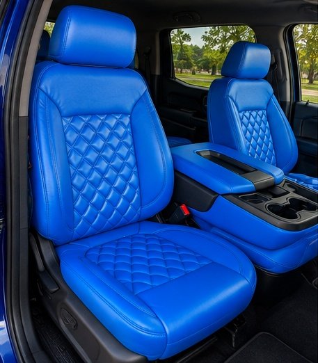 Custom blue leather truck seats with diamond quilting and center console