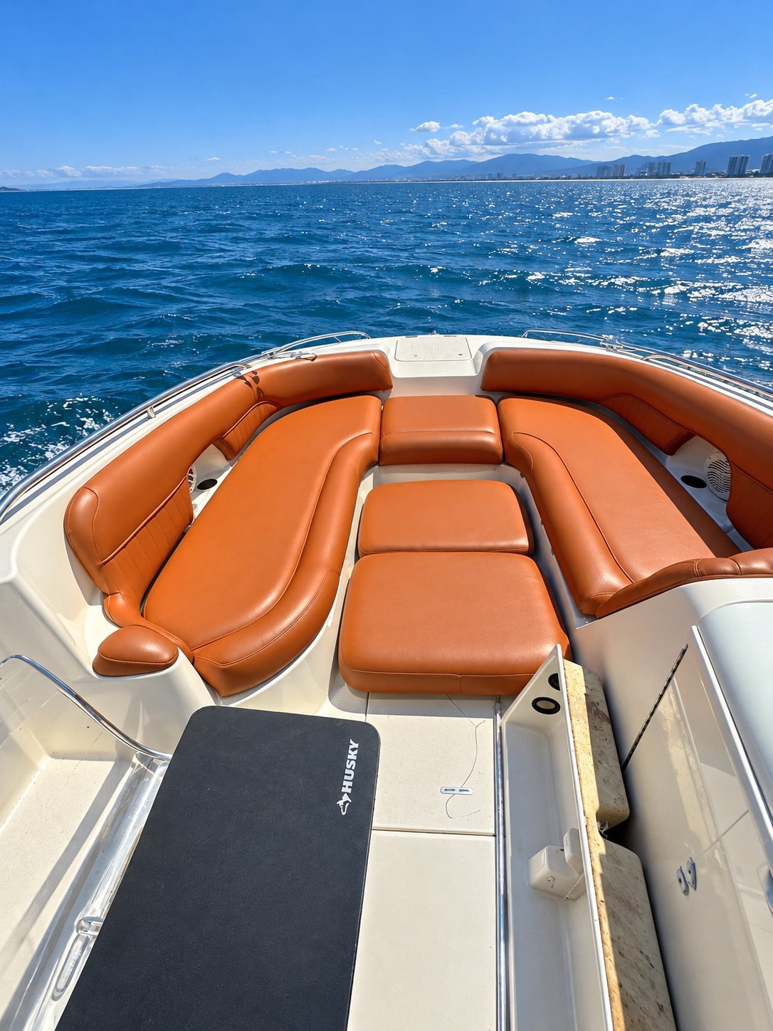 Cognac marine vinyl curved seating on a boat bow