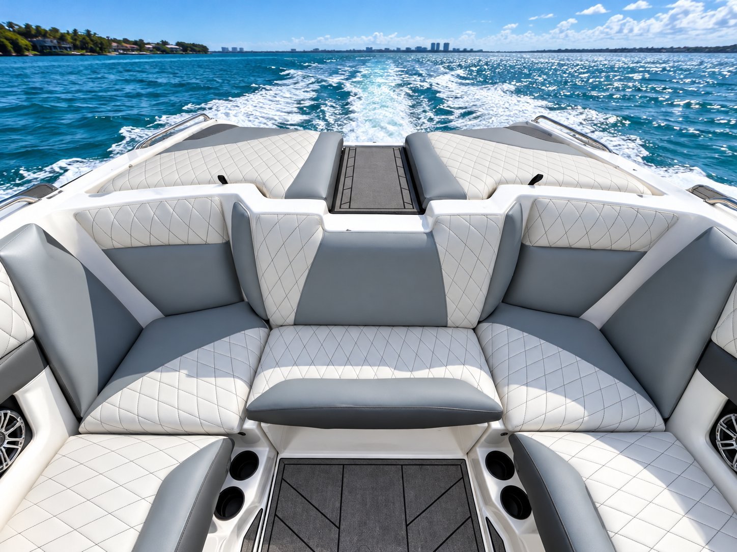 White and grey diamond-stitched marine seating on a sport boat stern